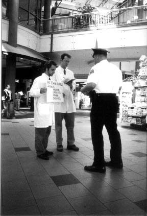 Cop and two Praxis members (aerial).